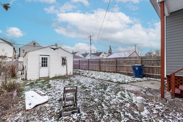 snowy yard with an outdoor structure