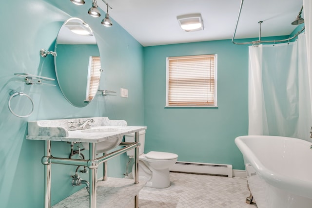 full bathroom featuring sink, toilet, plus walk in shower, and a baseboard heating unit