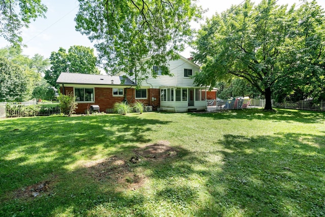 view of yard with a sunroom