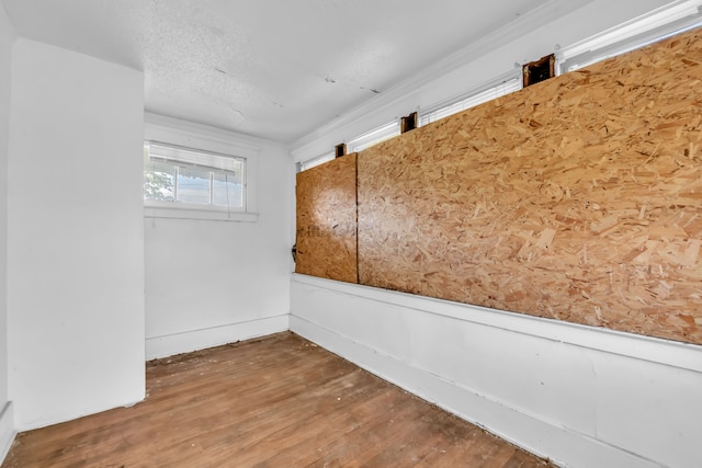 empty room featuring wood-type flooring