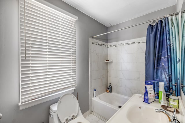 full bathroom with sink, shower / bathtub combination with curtain, a healthy amount of sunlight, and toilet