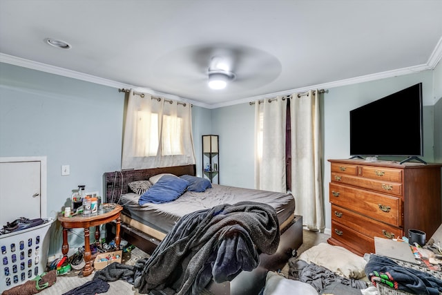 bedroom featuring carpet, ceiling fan, and crown molding