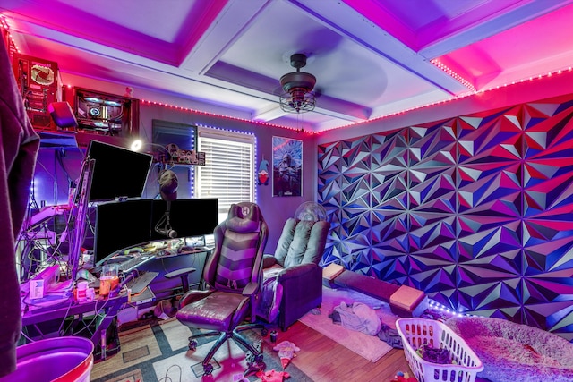 playroom featuring beamed ceiling, hardwood / wood-style floors, ceiling fan, and coffered ceiling