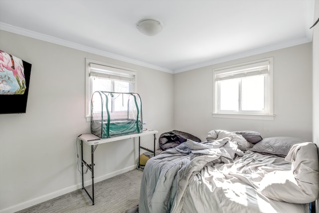 bedroom featuring light colored carpet and ornamental molding