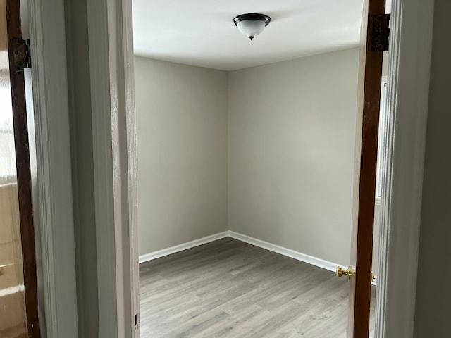 spare room with light hardwood / wood-style floors