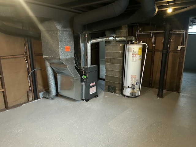 utility room with heating unit and water heater