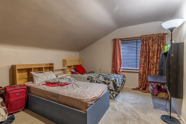 carpeted bedroom featuring lofted ceiling