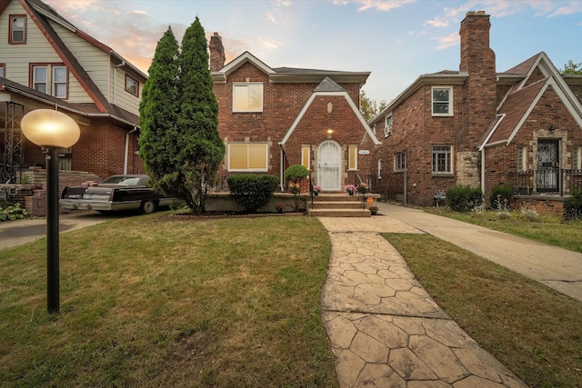 view of property featuring a lawn