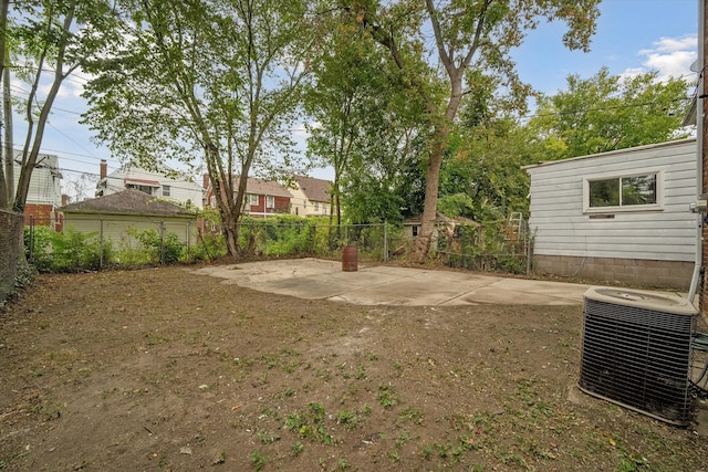 view of yard featuring a patio area and central air condition unit