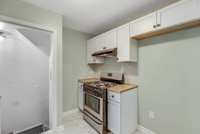 kitchen featuring wooden counters, white cabinets, and range with gas stovetop