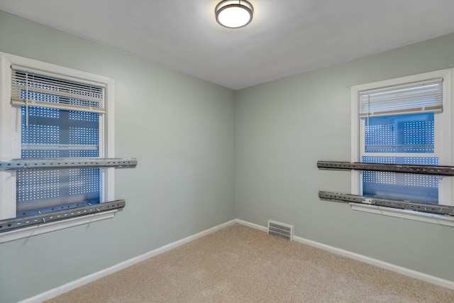 empty room featuring carpet floors