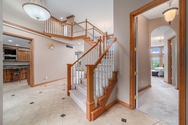 staircase featuring carpet floors