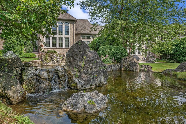 exterior space with a water view