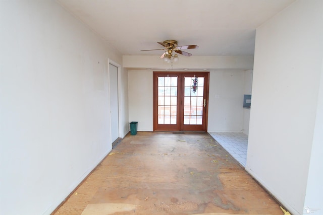 interior space with french doors and ceiling fan