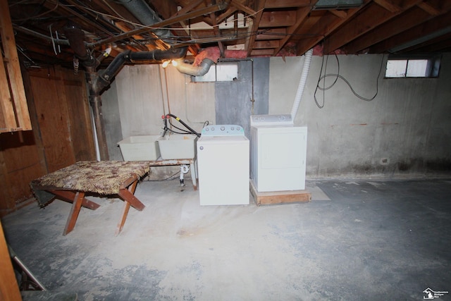 basement with washing machine and clothes dryer