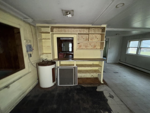 kitchen featuring water heater and a baseboard radiator