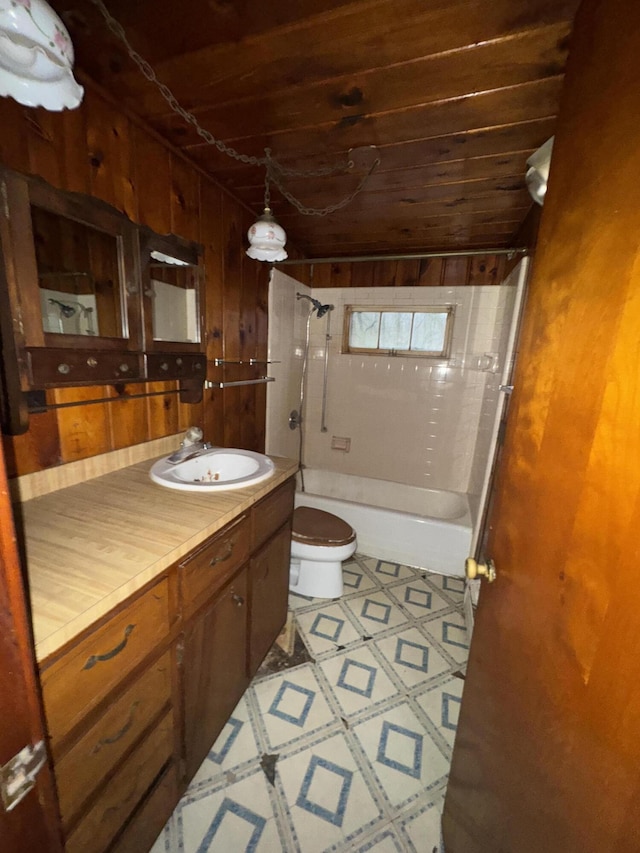 full bathroom featuring wood ceiling, vanity, shower / washtub combination, toilet, and wood walls