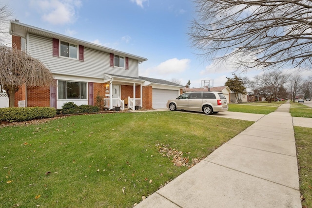 view of property featuring a front yard and a garage