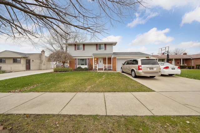 view of front of house featuring a garage and a front lawn