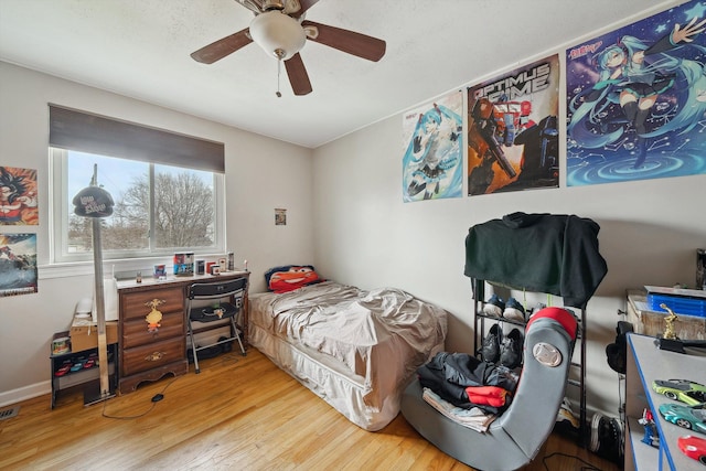 bedroom featuring wood-type flooring and ceiling fan