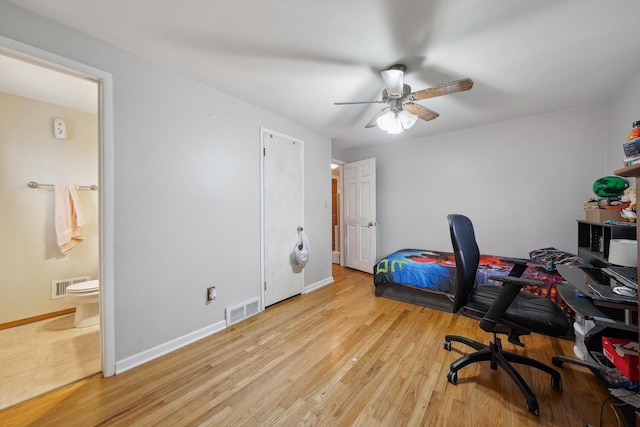 office with ceiling fan and light wood-type flooring