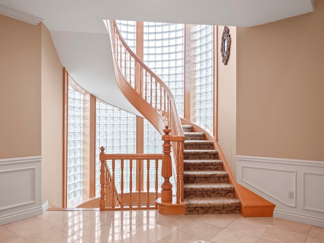 stairway featuring tile patterned floors