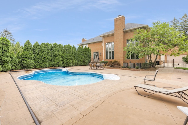 view of swimming pool featuring a patio