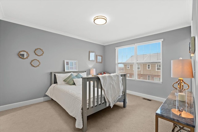 carpeted bedroom featuring ornamental molding