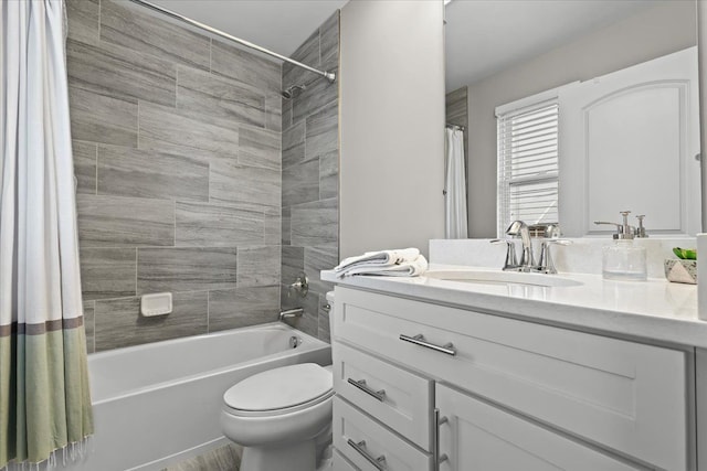 full bathroom with toilet, vanity, and shower / bath combo with shower curtain