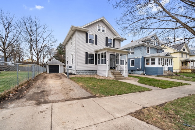 front of property featuring a sunroom, an outbuilding, a front yard, and a garage