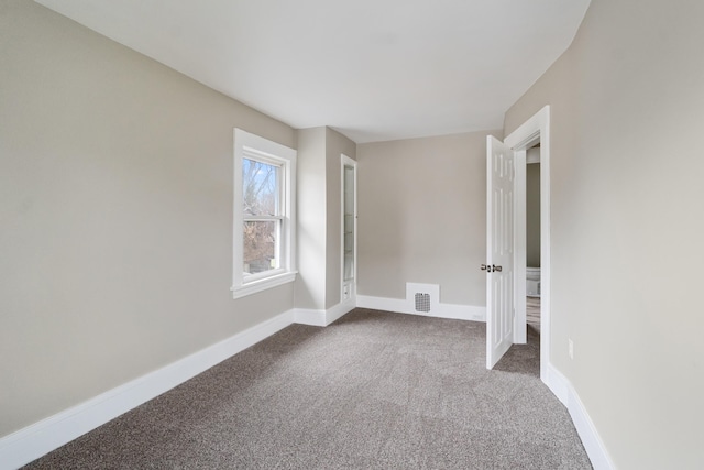 unfurnished room with carpet floors