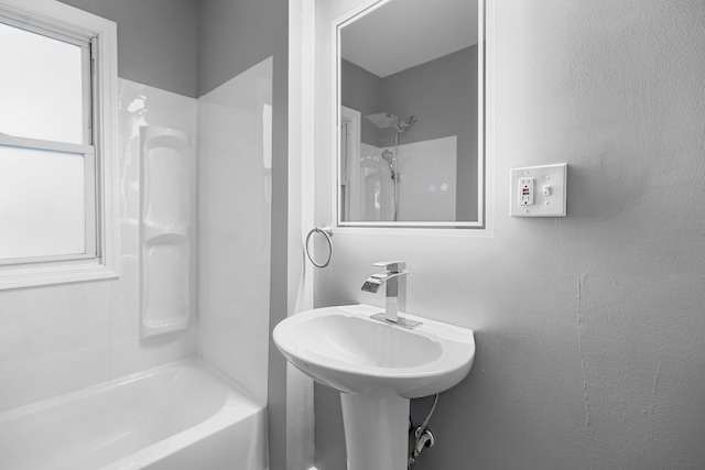 bathroom featuring  shower combination