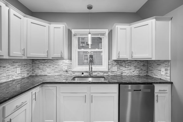 kitchen with pendant lighting, sink, white cabinetry, and dishwasher