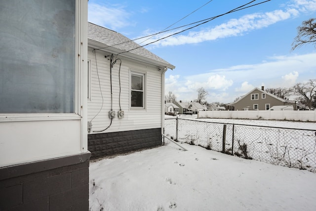 view of yard layered in snow