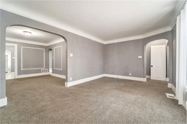 carpeted spare room featuring ornamental molding