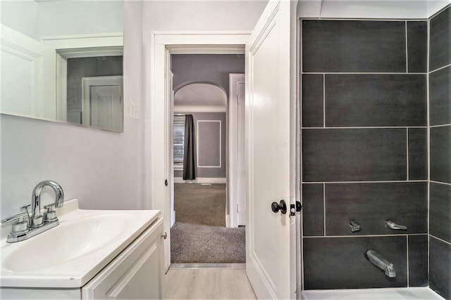 bathroom with vanity and wood-type flooring