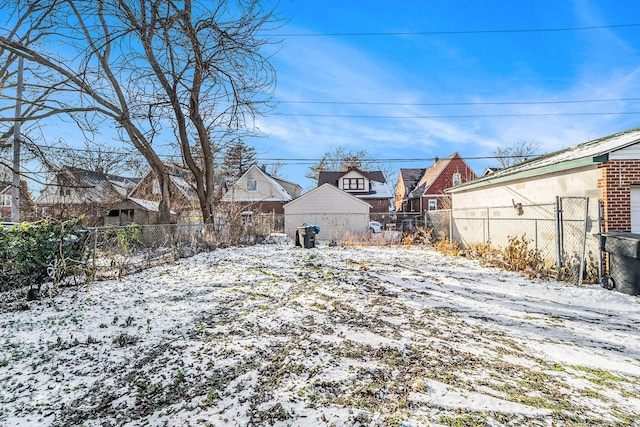 view of yard layered in snow