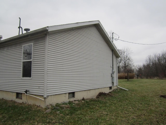 view of property exterior with a lawn