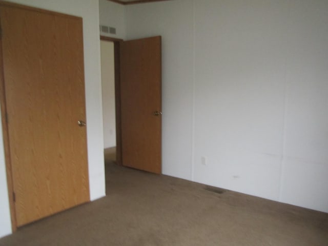 unfurnished bedroom with carpet