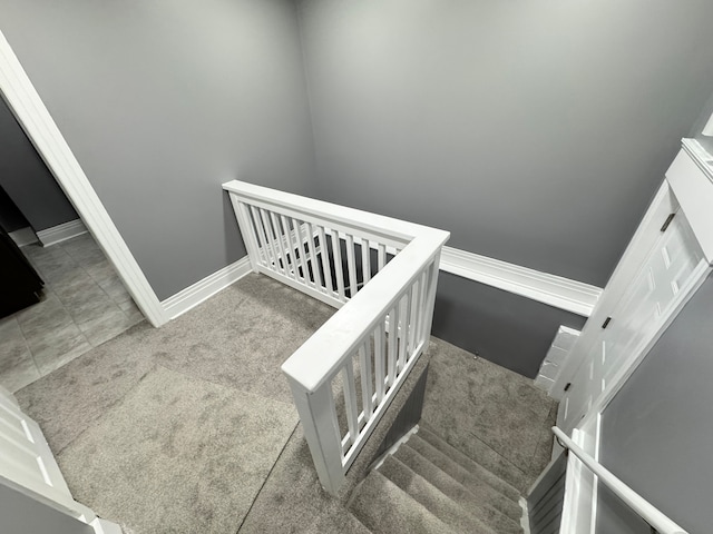 staircase with carpet flooring