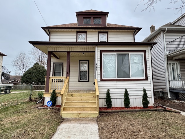 bungalow-style home with a front yard