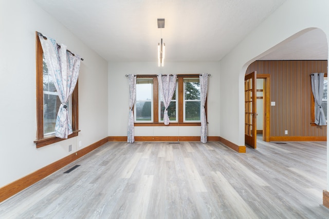 empty room with light hardwood / wood-style floors