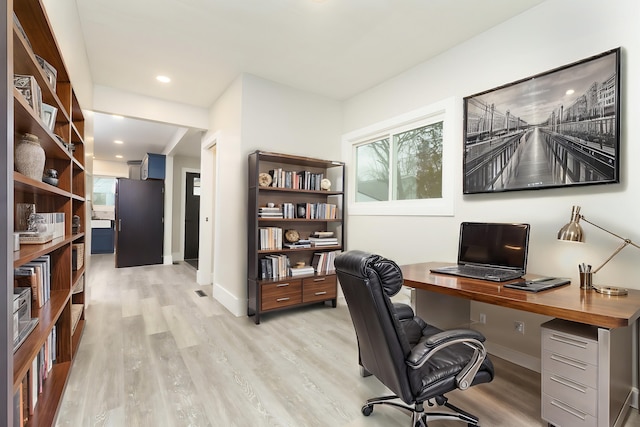 home office with light wood-type flooring