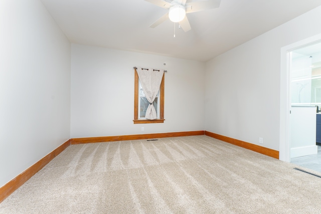 empty room with carpet and ceiling fan