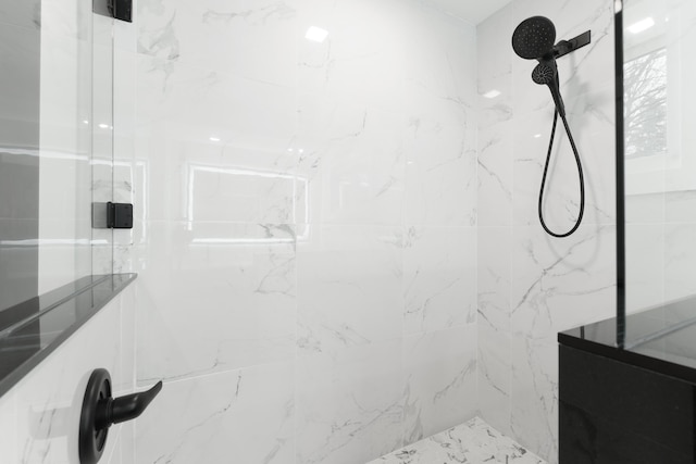 bathroom with tiled shower
