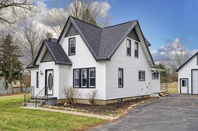 view of property featuring a front lawn