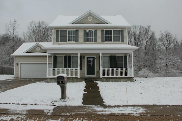 view of front of house with covered porch and a garage