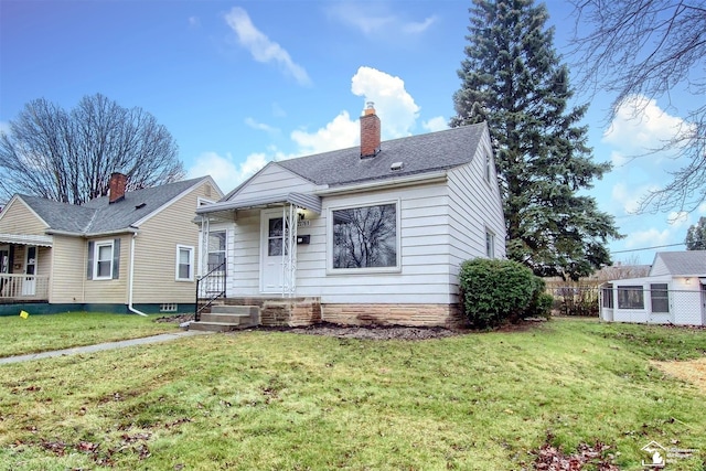 bungalow-style home with a front lawn