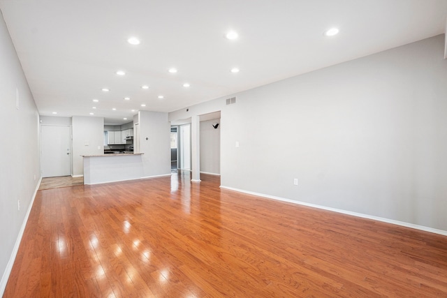 unfurnished living room featuring light hardwood / wood-style floors