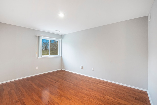 empty room featuring wood-type flooring